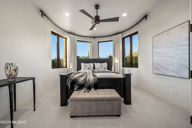 carpeted bedroom featuring ceiling fan