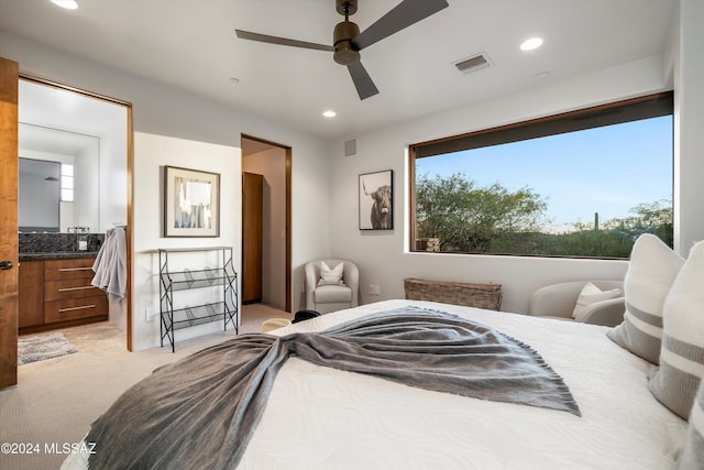 carpeted bedroom featuring ceiling fan