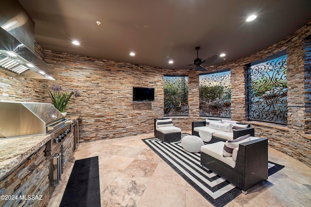 view of patio featuring area for grilling, ceiling fan, and outdoor lounge area