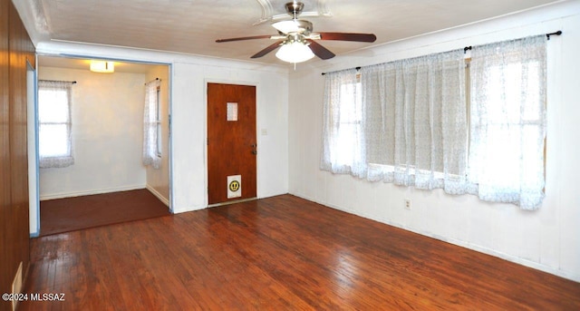 unfurnished bedroom with ceiling fan and wood-type flooring