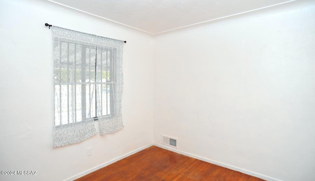 spare room featuring hardwood / wood-style floors