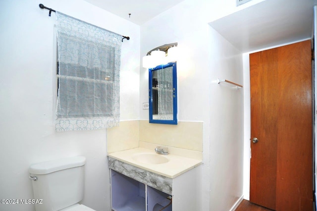 bathroom featuring sink and toilet