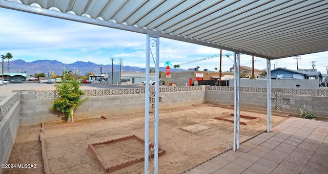 view of patio / terrace with a mountain view