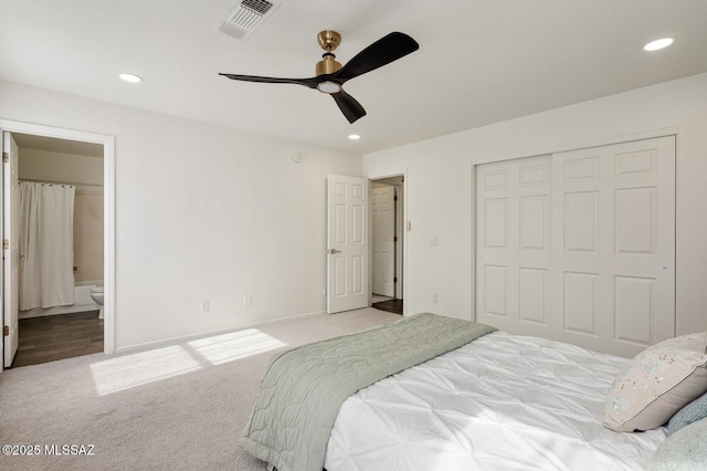 bedroom featuring recessed lighting, carpet flooring, visible vents, a closet, and ensuite bath