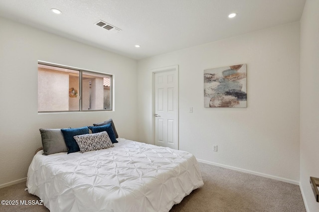 bedroom with carpet floors, baseboards, visible vents, and recessed lighting