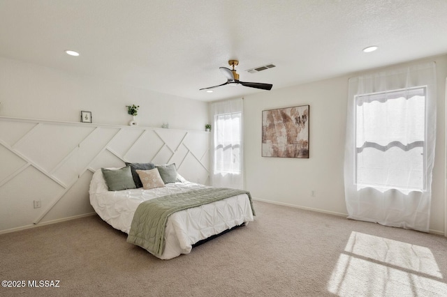 bedroom featuring recessed lighting, light carpet, a ceiling fan, visible vents, and baseboards