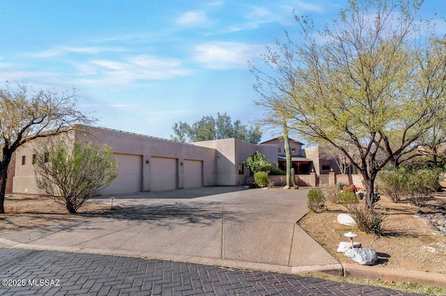 adobe home featuring a garage