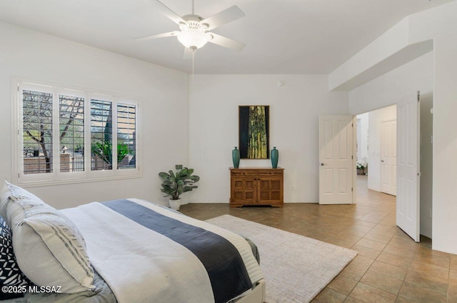 tiled bedroom with ceiling fan