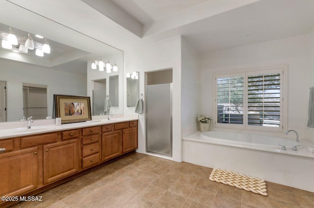 bathroom featuring vanity, independent shower and bath, and a raised ceiling