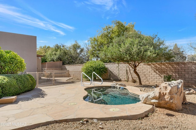 view of swimming pool featuring a patio area