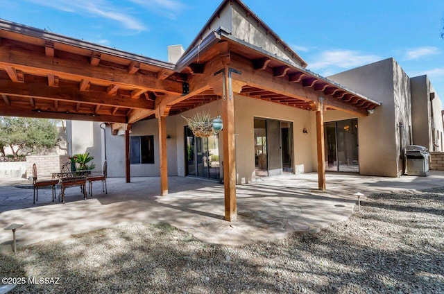 back of house with a patio