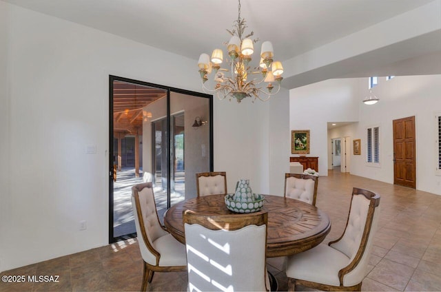 dining area with an inviting chandelier