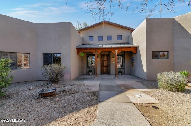 southwest-style home featuring a patio