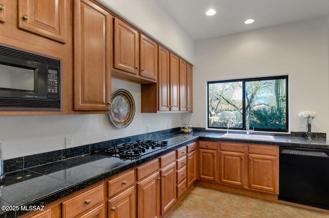 kitchen with sink and black appliances