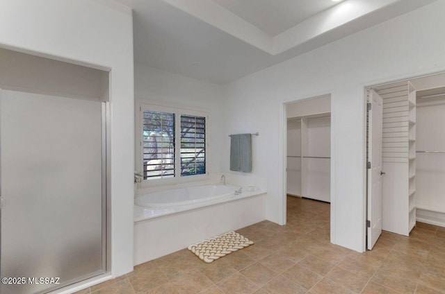 bathroom featuring separate shower and tub