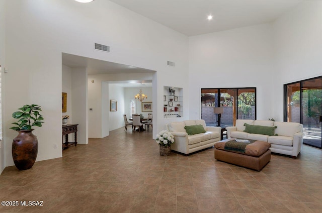 living room with a notable chandelier