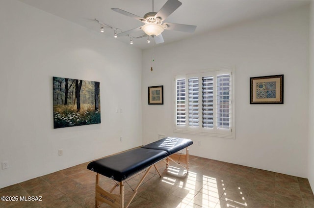 miscellaneous room featuring rail lighting and ceiling fan