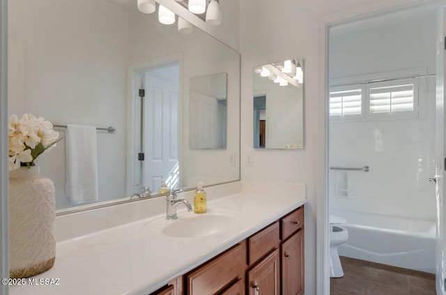 full bathroom featuring tile patterned flooring, vanity, shower / washtub combination, and toilet