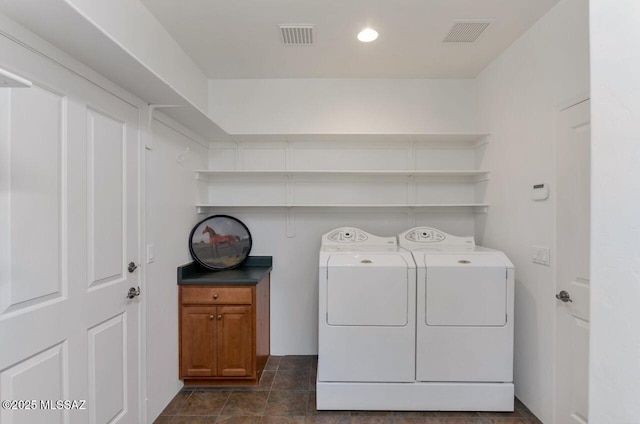 laundry area with washing machine and dryer