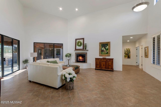 living room featuring a high ceiling