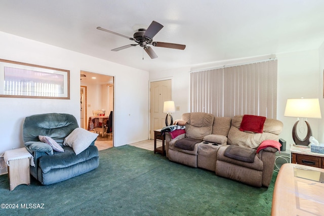 living room with carpet and ceiling fan