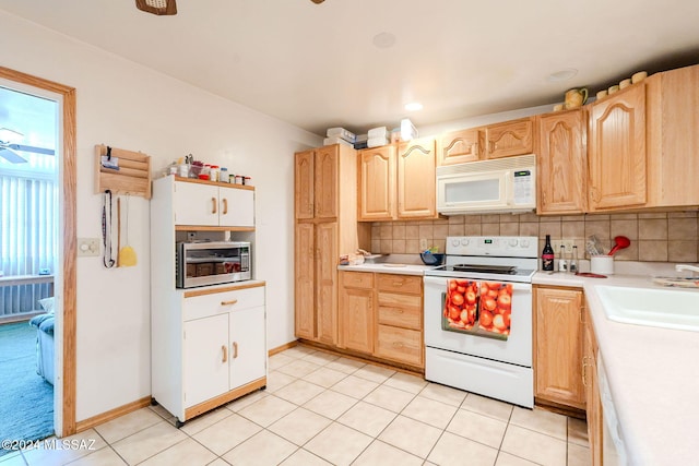 kitchen featuring tasteful backsplash, white appliances, sink, light brown cabinets, and light tile patterned flooring