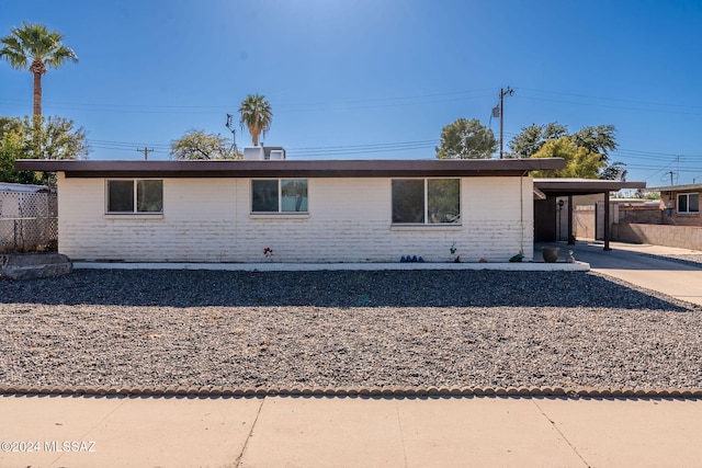 view of front of home featuring a carport