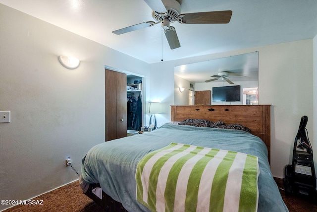 carpeted bedroom featuring a closet and ceiling fan