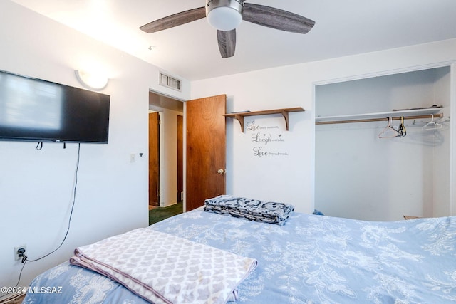 bedroom with ceiling fan and a closet