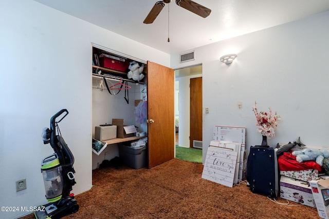 office space featuring dark colored carpet and ceiling fan