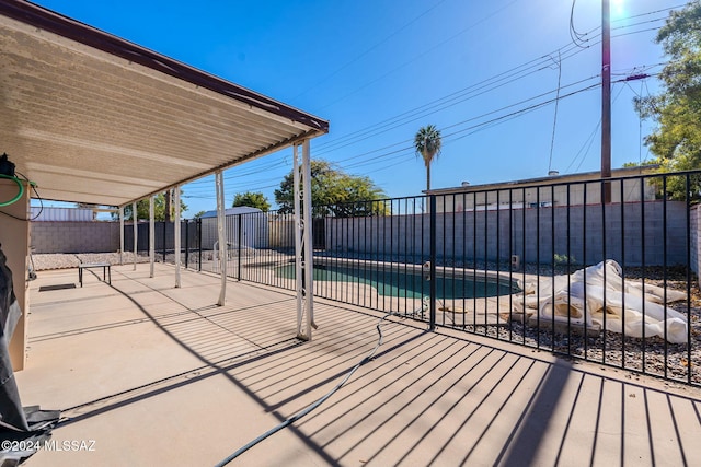 view of pool featuring a patio