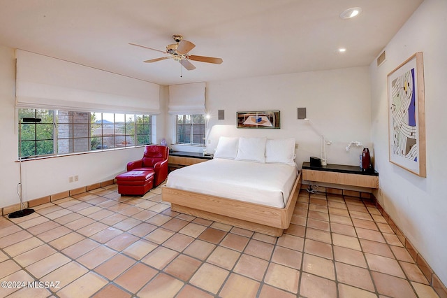 bedroom featuring ceiling fan and light tile patterned floors