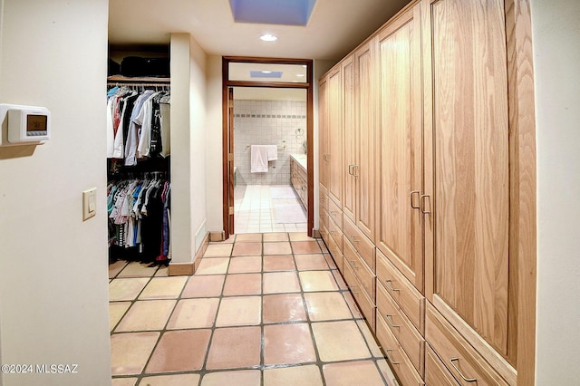 hallway with light tile patterned floors