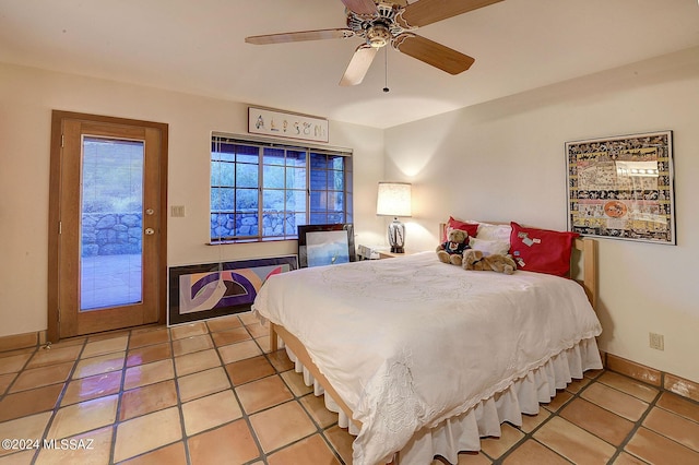 bedroom featuring ceiling fan, light tile patterned floors, and access to outside