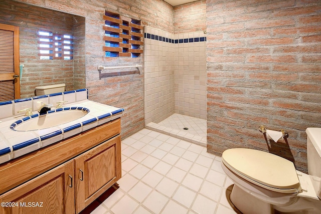 bathroom featuring toilet, vanity, and walk in shower