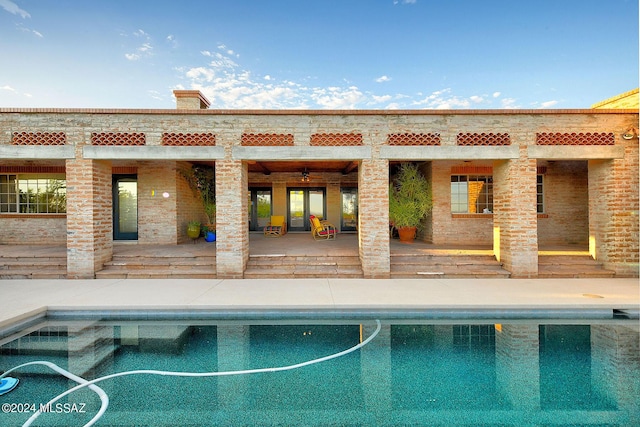 view of pool featuring ceiling fan and a patio area