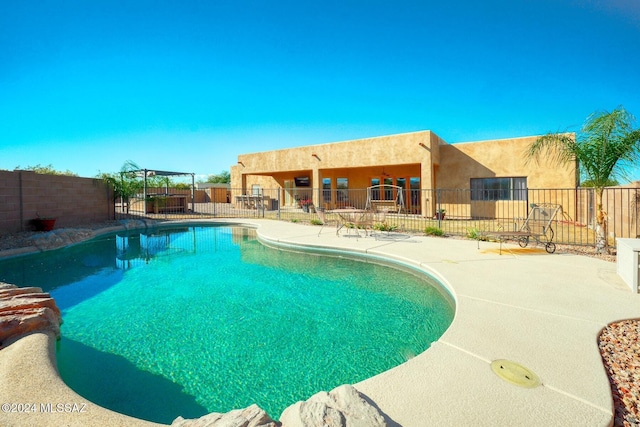 view of swimming pool featuring a patio area