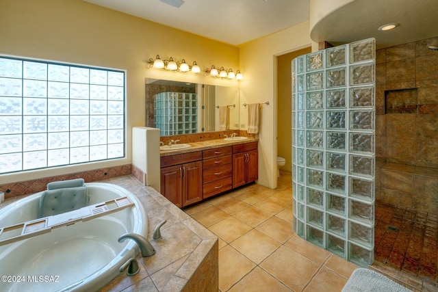 full bathroom featuring tile patterned flooring, vanity, toilet, and plus walk in shower