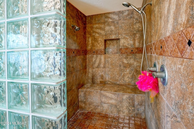 bathroom featuring a tile shower