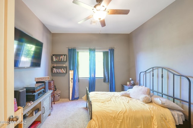 bedroom with light carpet and ceiling fan