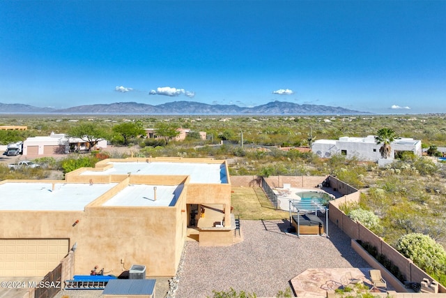 birds eye view of property with a mountain view