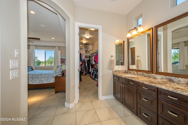 bathroom featuring ceiling fan and vanity