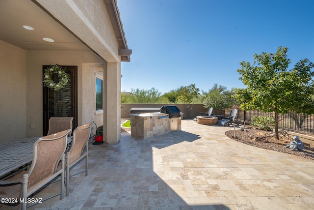 view of patio / terrace featuring a grill and exterior kitchen