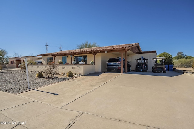 mediterranean / spanish home featuring a carport