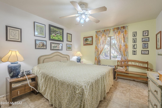 bedroom with light tile patterned floors and ceiling fan