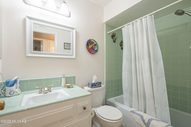 full bathroom featuring vanity, toilet, and shower / bathtub combination with curtain