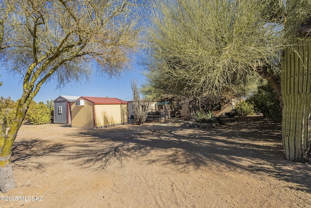 exterior space with a storage shed