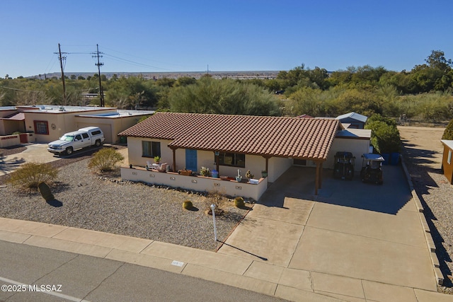 view of front of home featuring a carport