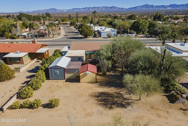 birds eye view of property featuring a mountain view