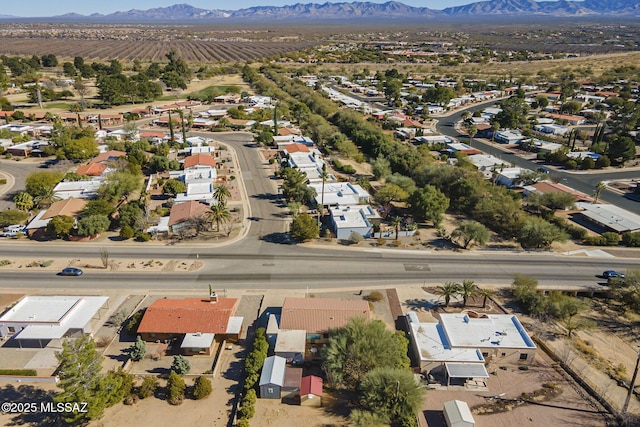 birds eye view of property featuring a mountain view